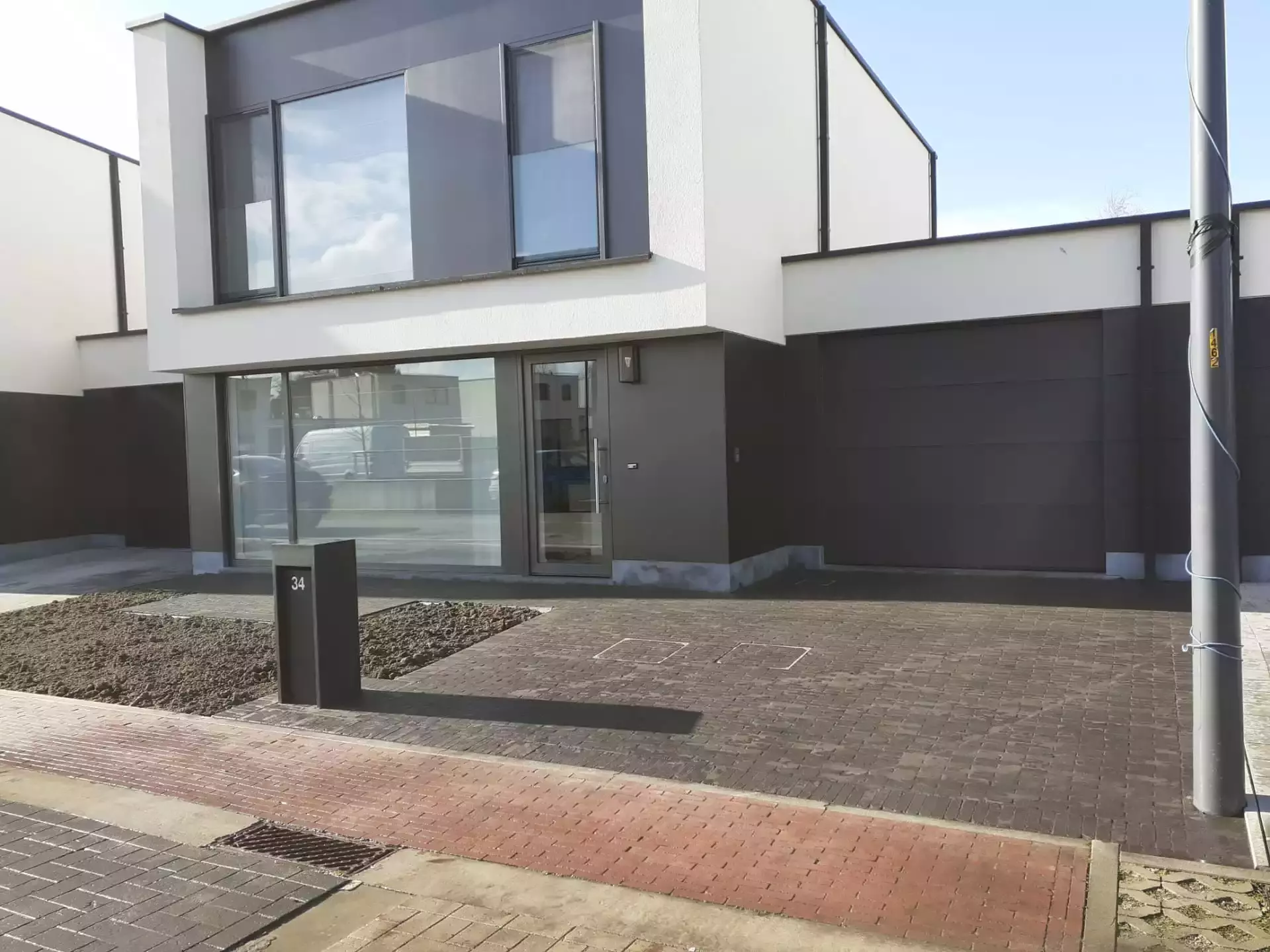 Oprit in kleiklinkers te Dilbeek – foto 1